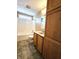 Clean bathroom with tub/shower, toilet, and wood vanity with extra storage at 2103 Twelve Oaks Dr, Shelbyville, IN 46176