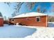 Brick home exterior with snow-covered yard at 2345 Churchman Ave, Indianapolis, IN 46203