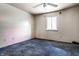 Small bedroom with worn carpet and painted walls at 2345 Churchman Ave, Indianapolis, IN 46203