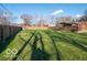 Large backyard with grassy lawn and deck with pergola at 3050 N County Road 950 E, Brownsburg, IN 46112