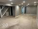 Finished basement featuring carpeting, recessed lighting, and staircase access at 3426 Royal Oak Dr, Indianapolis, IN 46227