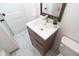 Updated bathroom with modern vanity and marble-look tile at 3501 Caroline Ave, Indianapolis, IN 46218