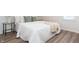 Bright bedroom with wood-look flooring and neutral decor at 3501 Caroline Ave, Indianapolis, IN 46218
