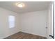 Well-lit bedroom featuring wood flooring and neutral walls at 3501 Caroline Ave, Indianapolis, IN 46218