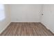 Empty bedroom with wood flooring and neutral walls at 3501 Caroline Ave, Indianapolis, IN 46218