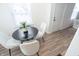 Dining area with round table and four white chairs at 3501 Caroline Ave, Indianapolis, IN 46218