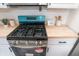 Modern kitchen with teal stove and butcher block counters at 3501 Caroline Ave, Indianapolis, IN 46218