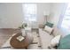 Living room with a beige sofa and two comfy armchairs at 3501 Caroline Ave, Indianapolis, IN 46218