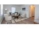 Bright living room with beige sofa, and two armchairs at 3501 Caroline Ave, Indianapolis, IN 46218