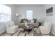 Living room with light beige sofa and two armchairs at 3501 Caroline Ave, Indianapolis, IN 46218