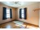 Simple bedroom with hardwood floors and two windows at 3504 Raible Ave, Anderson, IN 46011