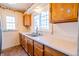 Kitchen with wood cabinets and double sink at 3504 Raible Ave, Anderson, IN 46011