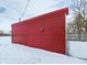 Red metal garage in a snowy backyard at 374 E 500 N, Anderson, IN 46012