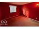 Red-walled bedroom with window and closet at 468 Ashby Dr, Greenfield, IN 46140