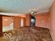 Open living room, brown carpet, view of kitchen at 468 Ashby Dr, Greenfield, IN 46140