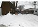 Snowy backyard with shed and wooden fence at 5325 Oliver Ave, Indianapolis, IN 46241