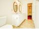 Double vanity bathroom with tile flooring and access to a hallway at 5334 Thrasher Dr, Indianapolis, IN 46254