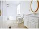 Clean bathroom with a corner bathtub, toilet and modern vanity at 5334 Thrasher Dr, Indianapolis, IN 46254