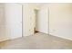 Bedroom with double closets and neutral colored walls and carpet at 5334 Thrasher Dr, Indianapolis, IN 46254