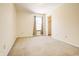 Bedroom with carpeted floor, window, and adjacent closet at 5334 Thrasher Dr, Indianapolis, IN 46254