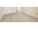 Simple bedroom with carpet flooring and access to a hallway at 5334 Thrasher Dr, Indianapolis, IN 46254