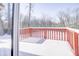 Back deck covered in snow with red railing at 5334 Thrasher Dr, Indianapolis, IN 46254