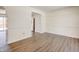 Empty dining room with light walls, wood-look floors, and access to kitchen at 5334 Thrasher Dr, Indianapolis, IN 46254