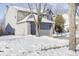 Two-story house exterior, gray siding, snowy landscape, and gray garage door at 5334 Thrasher Dr, Indianapolis, IN 46254