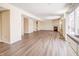 Spacious Gathering room with wood-look floors, fireplace, and large windows at 5334 Thrasher Dr, Indianapolis, IN 46254