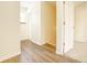 Hallway with hardwood floors and access to upstairs at 5334 Thrasher Dr, Indianapolis, IN 46254