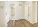 Bright hallway with hardwood floors and access to bedrooms at 5334 Thrasher Dr, Indianapolis, IN 46254