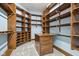 Large walk-in closet with custom shelving and drawers at 561 Fairwind, Brownsburg, IN 46112