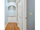 Light and airy hallway with hardwood floors and built-in storage at 561 Fairwind, Brownsburg, IN 46112