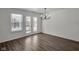 Simple dining room with hardwood floors and french doors leading to a patio at 5705 Tansy Ct, Indianapolis, IN 46203