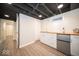 Basement wet bar with white cabinets and wood countertop at 5738 Norwaldo Ave, Indianapolis, IN 46220