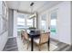 Spacious dining area with large windows and modern light fixture at 5780 Stetson Dr, Whitestown, IN 46052