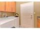 Convenient laundry room with washer, dryer, and exterior access at 6626 Easy St, Fishers, IN 46038