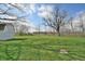Expansive backyard featuring lush greenery and a shed, perfect for outdoor activities at 67 W Brookville Rd, Fountaintown, IN 46130