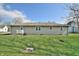 Spacious backyard showcasing the property's exterior and well-kept lawn at 67 W Brookville Rd, Fountaintown, IN 46130
