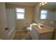 Clean bathroom with a vanity, toilet, and bathtub at 67 W Brookville Rd, Fountaintown, IN 46130