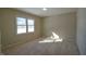 Spacious bedroom with large window and neutral decor at 67 W Brookville Rd, Fountaintown, IN 46130