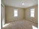 Well-lit bedroom with neutral walls and carpet flooring at 67 W Brookville Rd, Fountaintown, IN 46130