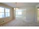 Bright dining room features a chandelier and view into the living room at 67 W Brookville Rd, Fountaintown, IN 46130