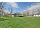 Well-maintained home with a charming exterior, expansive yard, and large driveway at 67 W Brookville Rd, Fountaintown, IN 46130