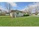 Charming home with a stone and siding exterior and a lush green lawn at 67 W Brookville Rd, Fountaintown, IN 46130