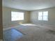 Spacious living room with carpeted floors and large windows at 67 W Brookville Rd, Fountaintown, IN 46130