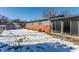 Snowy backyard with shed and brick patio at 6939 Maryvale Ct, Indianapolis, IN 46214