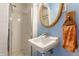 Small bathroom with a shower and pedestal sink at 6939 Maryvale Ct, Indianapolis, IN 46214