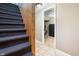Basement hallway with tiled floor and access to other rooms at 714 Berkley Rd, Indianapolis, IN 46208