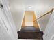 Basement stairs with carpeted steps and wooden handrail at 714 Berkley Rd, Indianapolis, IN 46208